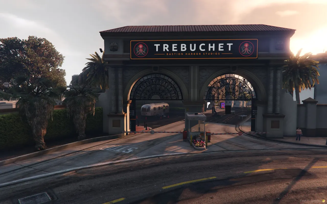 The TREBUCHET gate sign at sunset